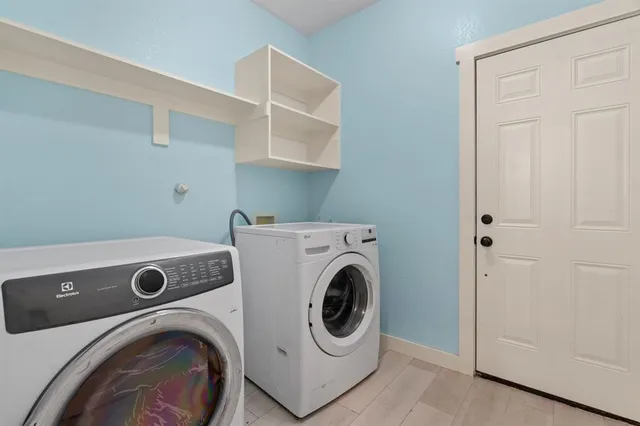 a kitchen with cabinets appliances and a sink