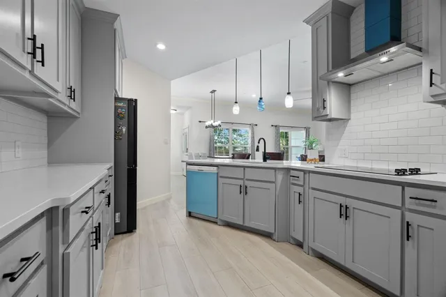a kitchen with cabinets and window