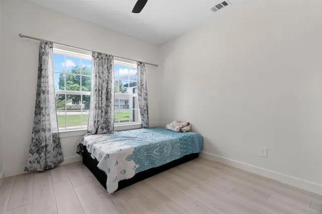 a view of a backyard with sitting area