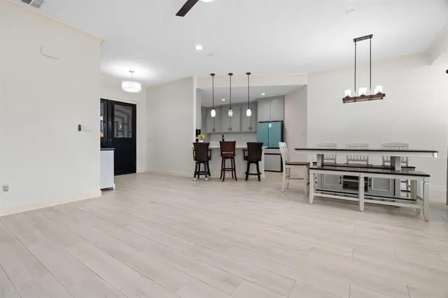 a view of a livingroom with furniture and chandelier