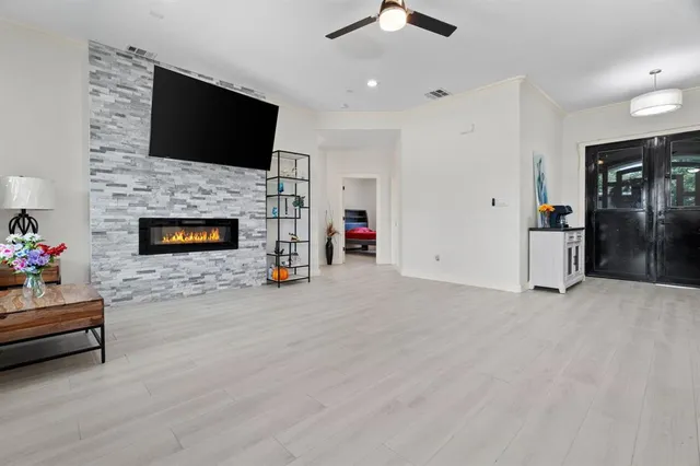 a living room with furniture and a fireplace
