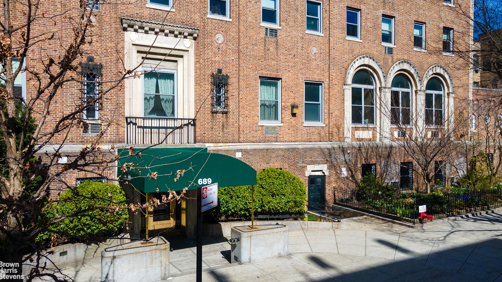 a view of a building with potted plants