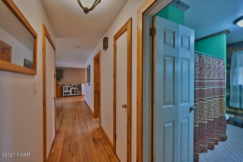 127 Estates Road Greentown, PA 18426 - Photo 23 of 85 a view of a hallway with wooden floor and staircase