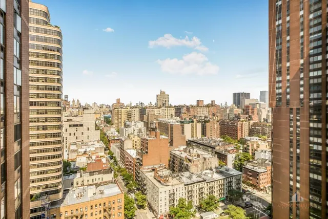 a view of a city with tall buildings