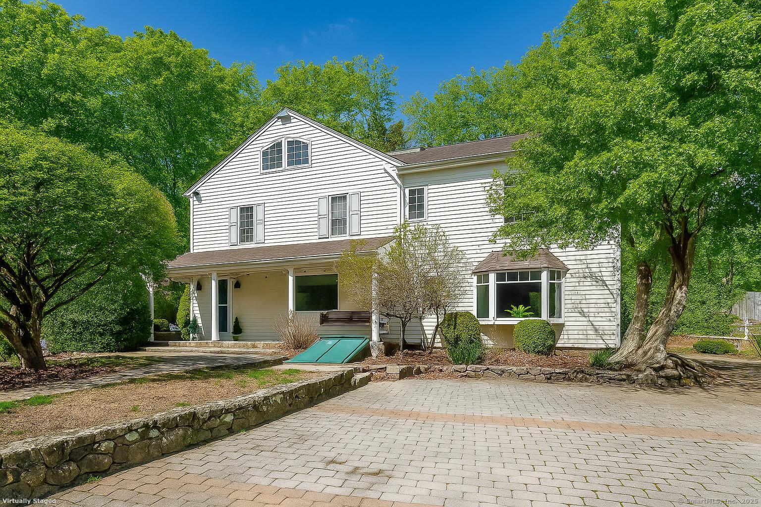 175 Mountain Road Wilton, CT 06897 - Photo 1 of 40 Charming curb appeal, green leaves virtually added to reflect summer season.