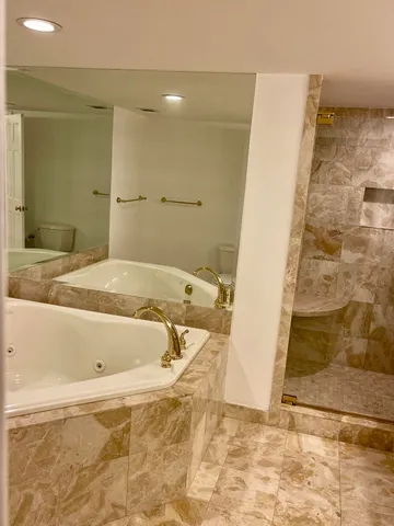 a lobby with furniture and a floor to ceiling window