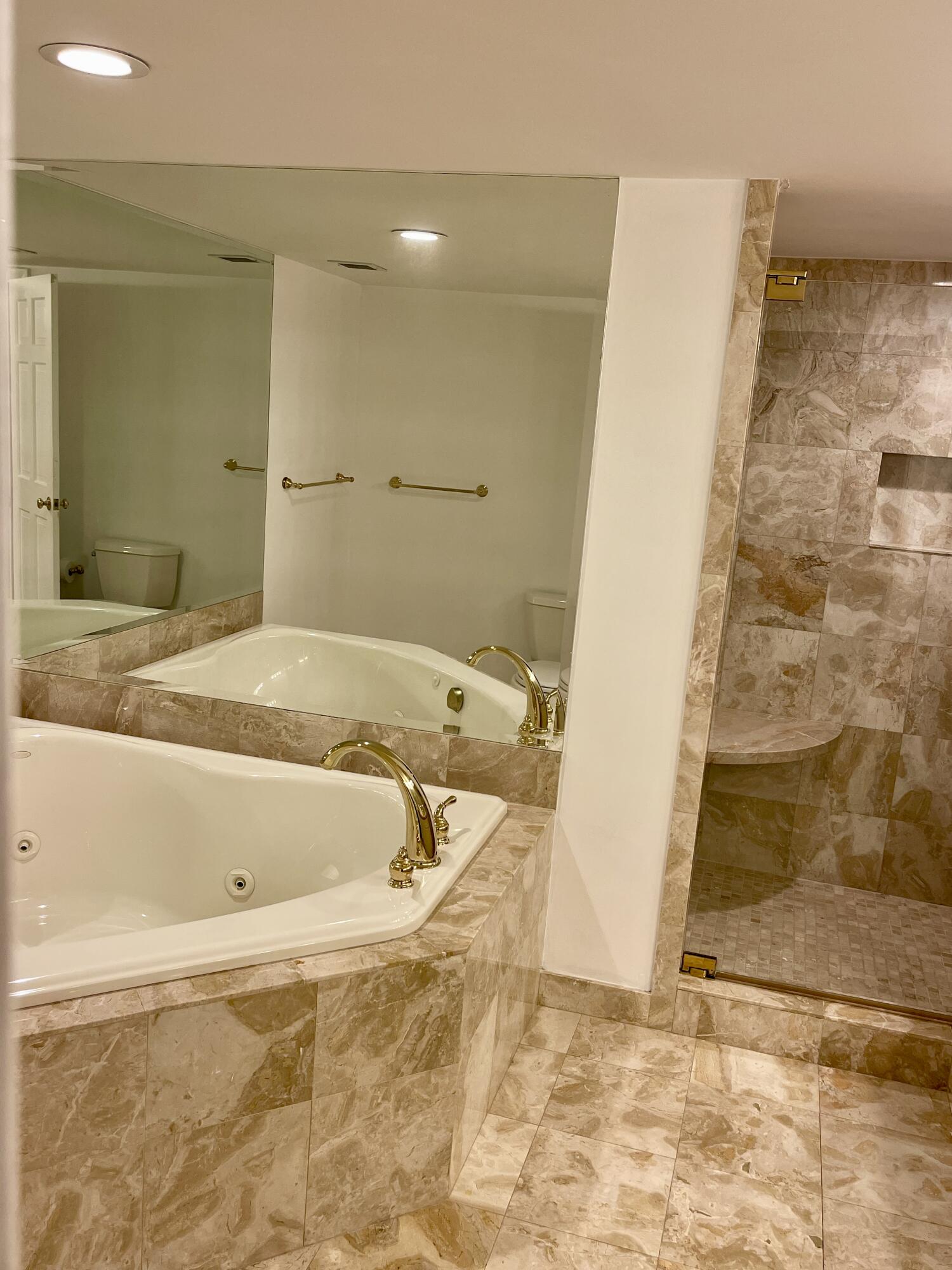 2001 North Ocean Boulevard, Unit 301 Boca Raton, FL 33431 - Photo 13 of 41 a bathroom with a tub