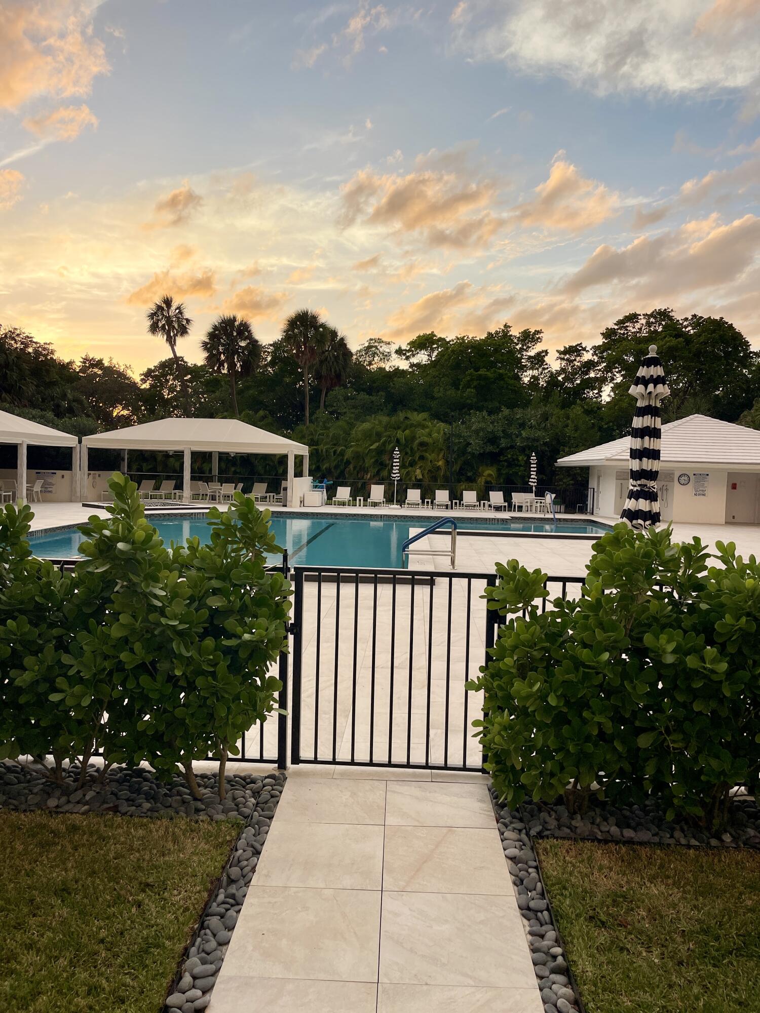 2001 North Ocean Boulevard, Unit 301 Boca Raton, FL 33431 - Photo 24 of 41 a view of a white house with a yard