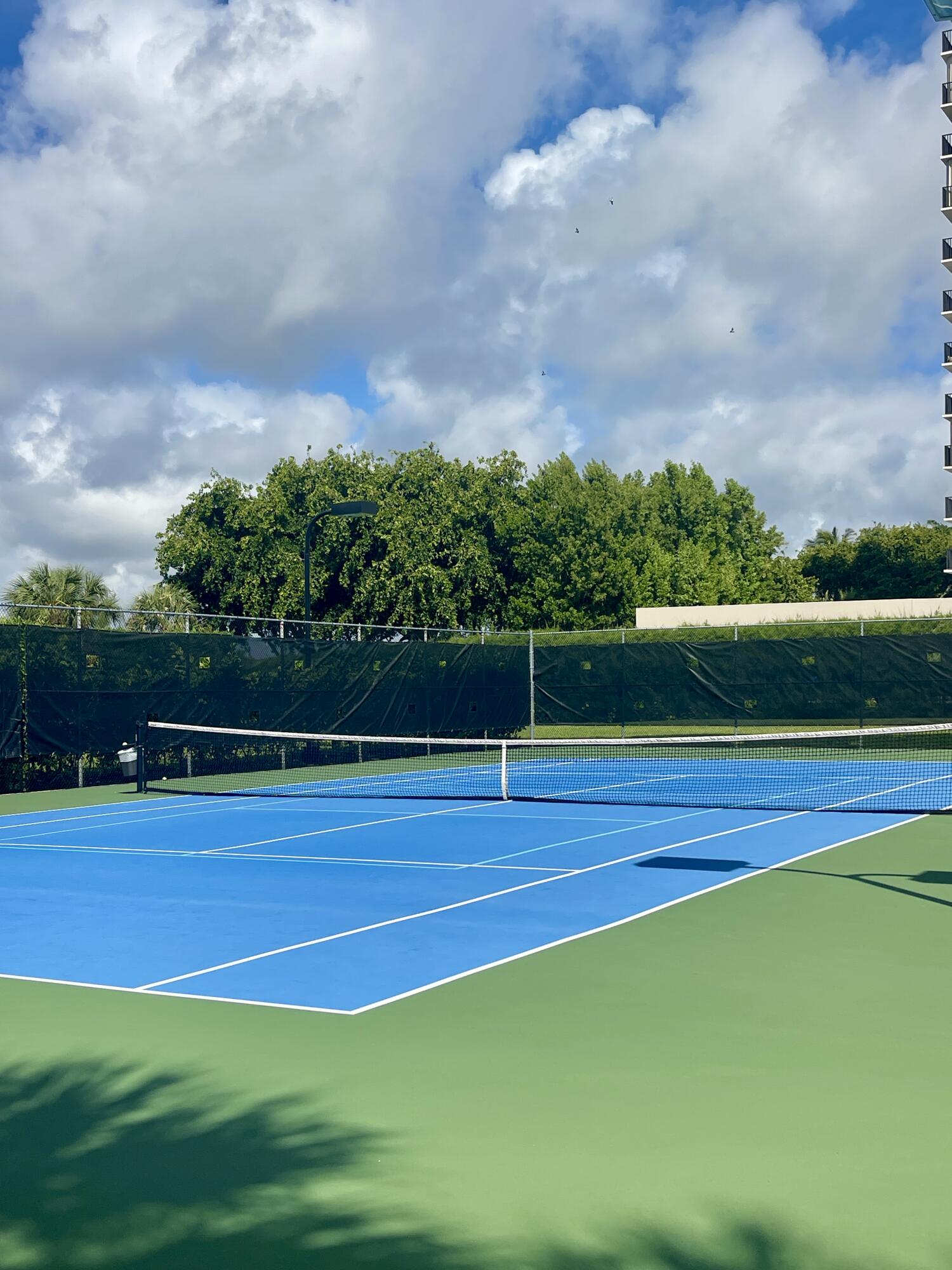 2001 North Ocean Boulevard, Unit 301 Boca Raton, FL 33431 - Photo 31 of 41 a view of an outdoor space and tennis court