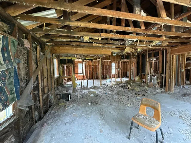 a front view of a building with outdoor seating