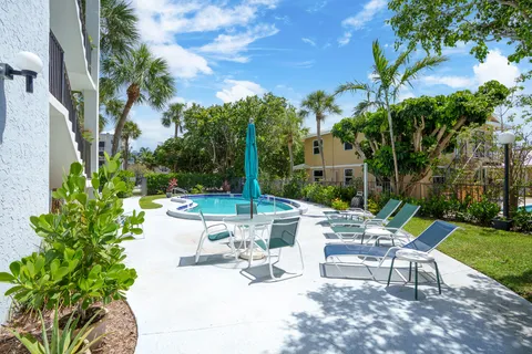 a view of a patio with a garden