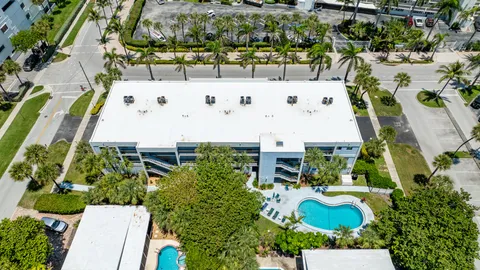 an aerial view of residential house with outdoor space and swimming pool