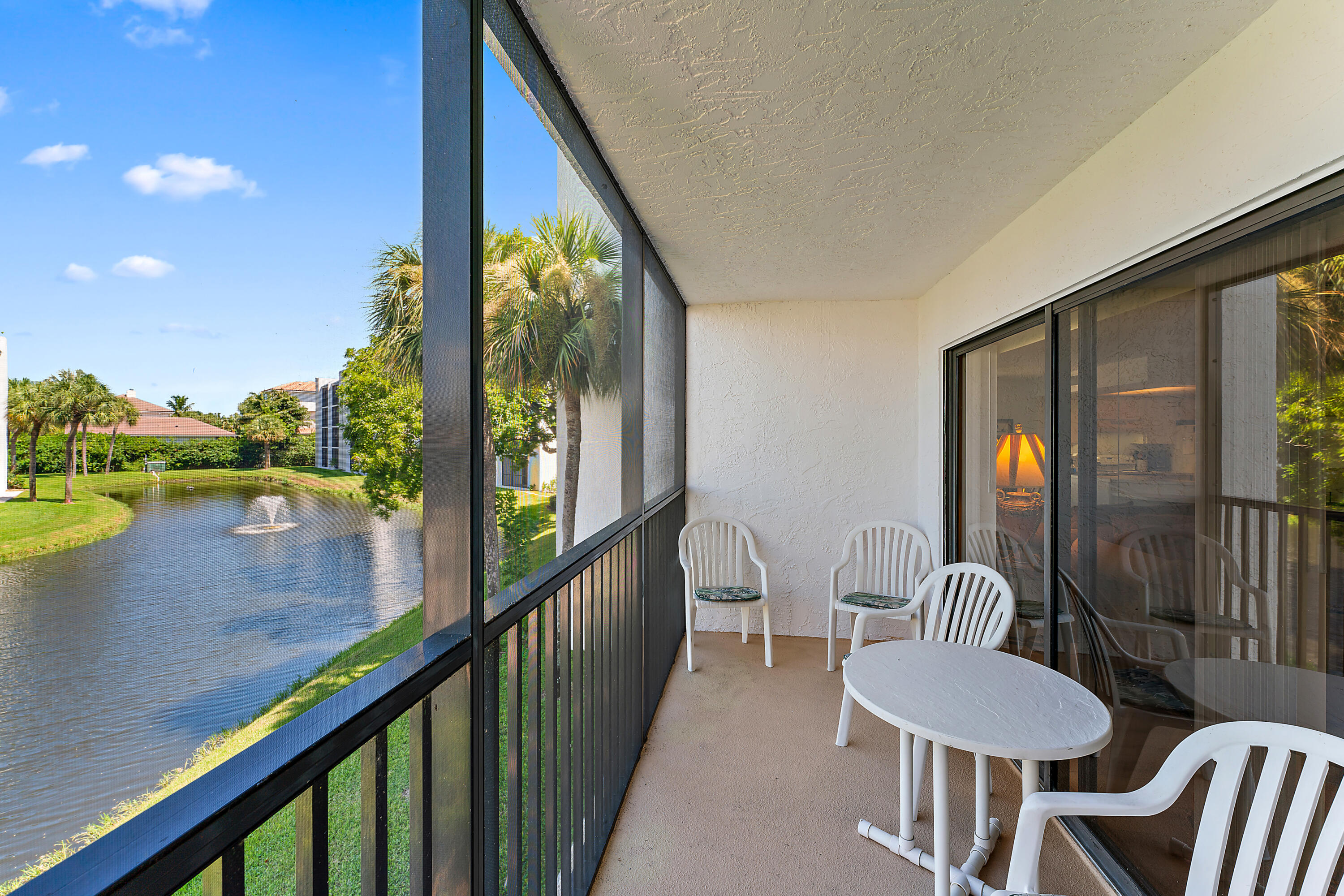 1605 Highway 1, Unit B201 Jupiter, FL 33477 - Photo 13 of 33 a view of a balcony with furniture and a floor to ceiling window