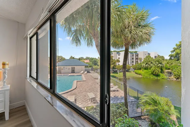 a view of a balcony with wooden floor and outdoor space