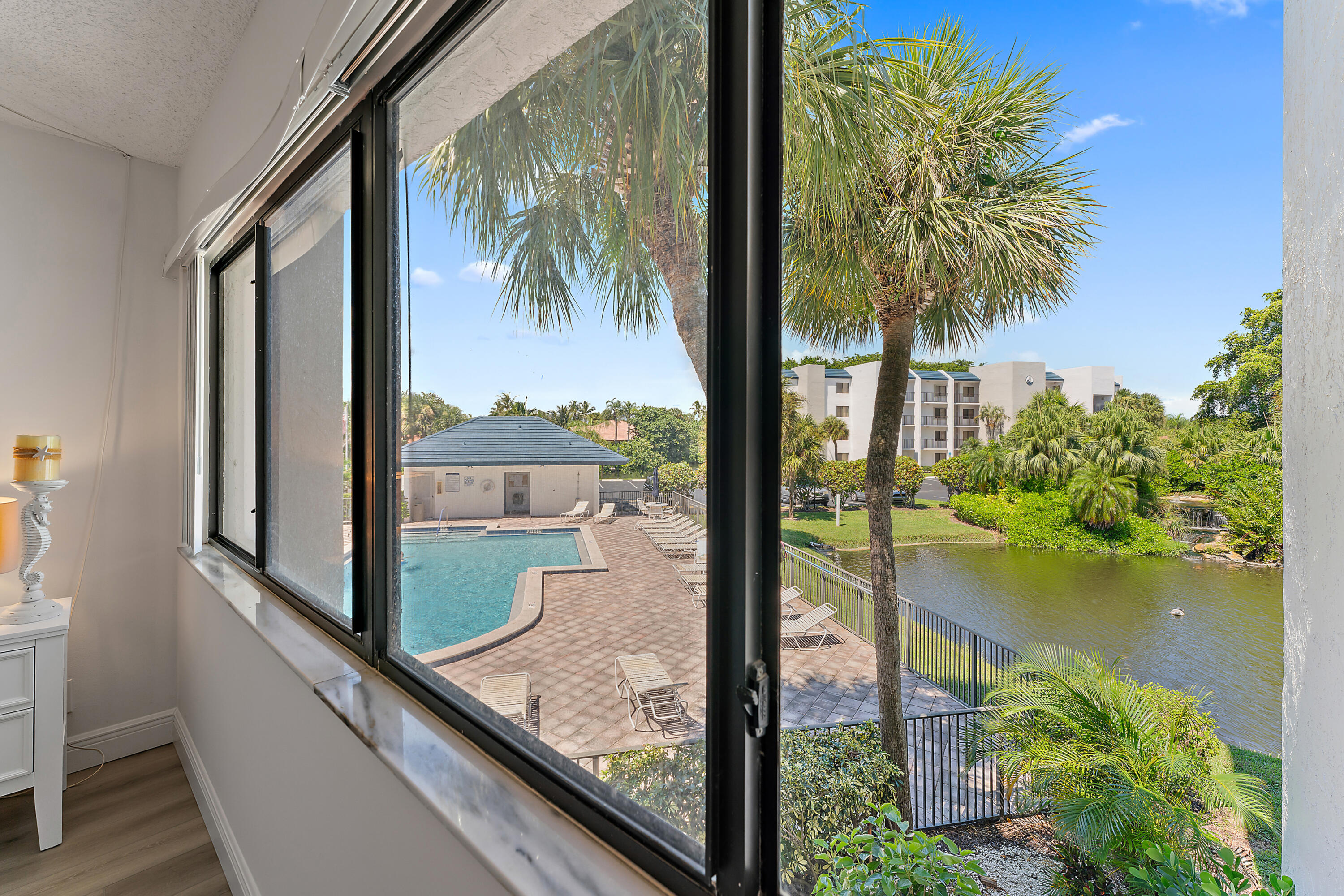 1605 Highway 1, Unit B201 Jupiter, FL 33477 - Photo 19 of 33 a view of a balcony with wooden floor and outdoor space