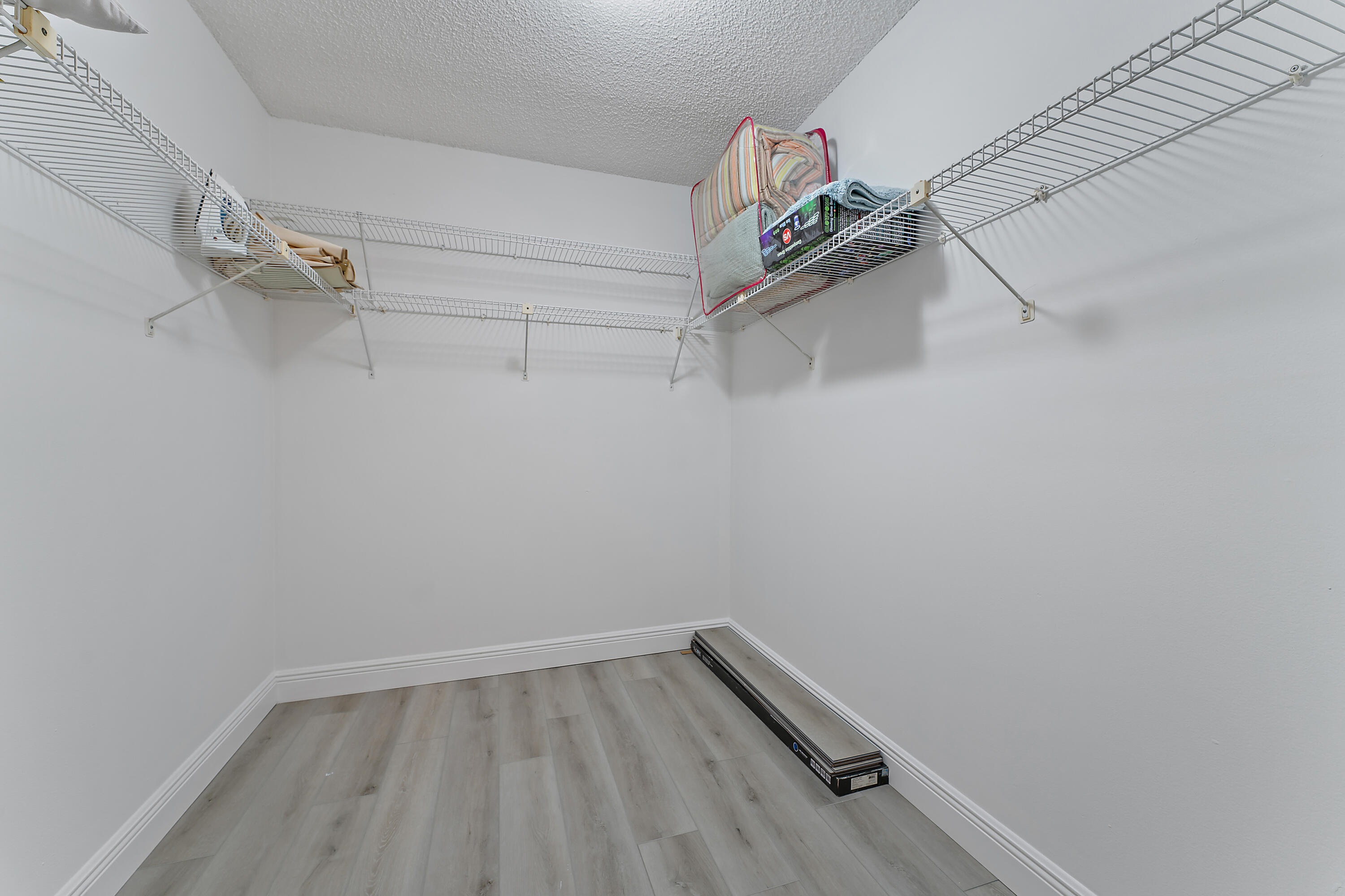 1605 Highway 1, Unit B201 Jupiter, FL 33477 - Photo 22 of 33 a view of a room with racks on the wall