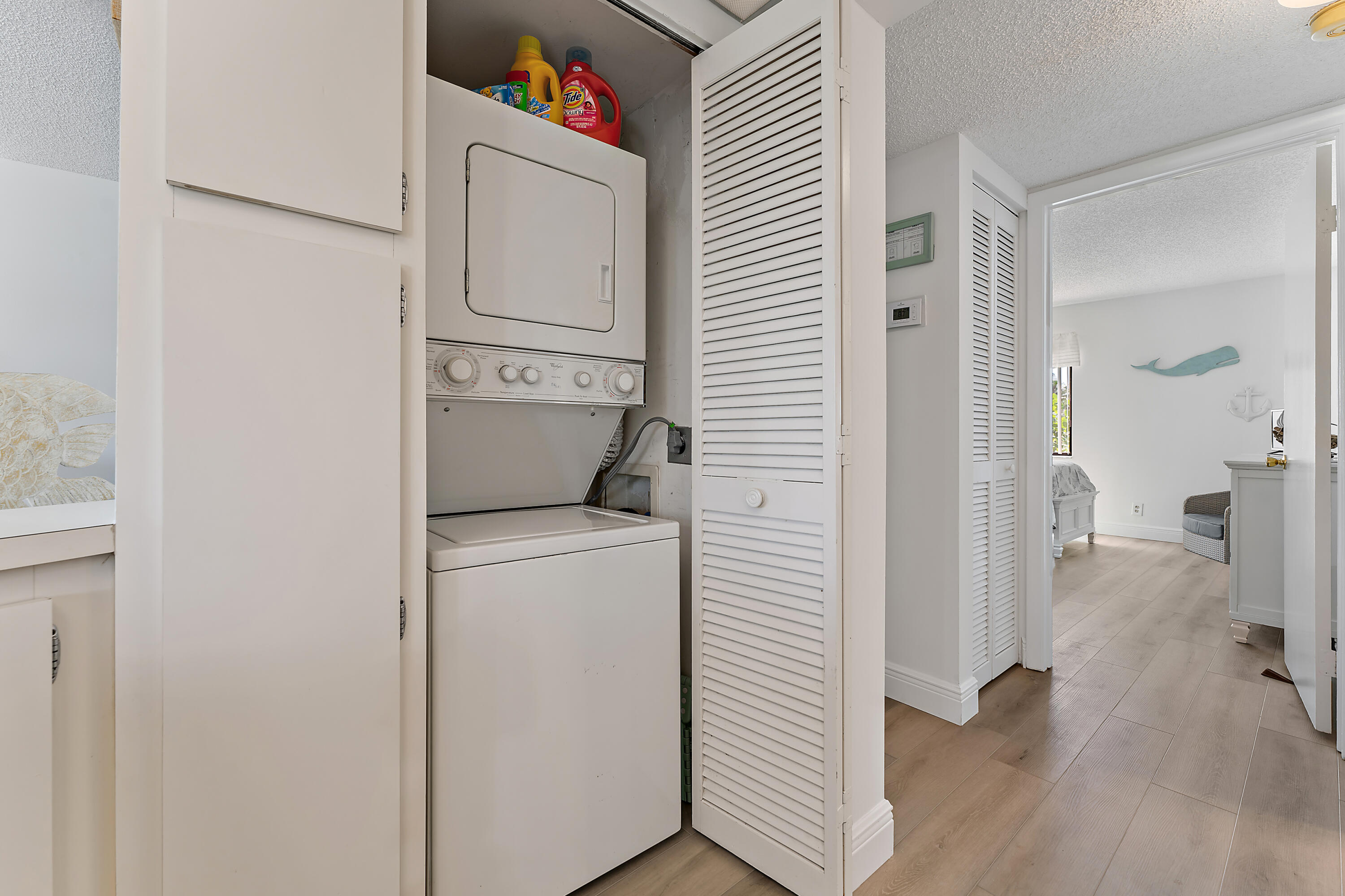 1605 Highway 1, Unit B201 Jupiter, FL 33477 - Photo 24 of 33 a view of bathroom with a washer and dryer
