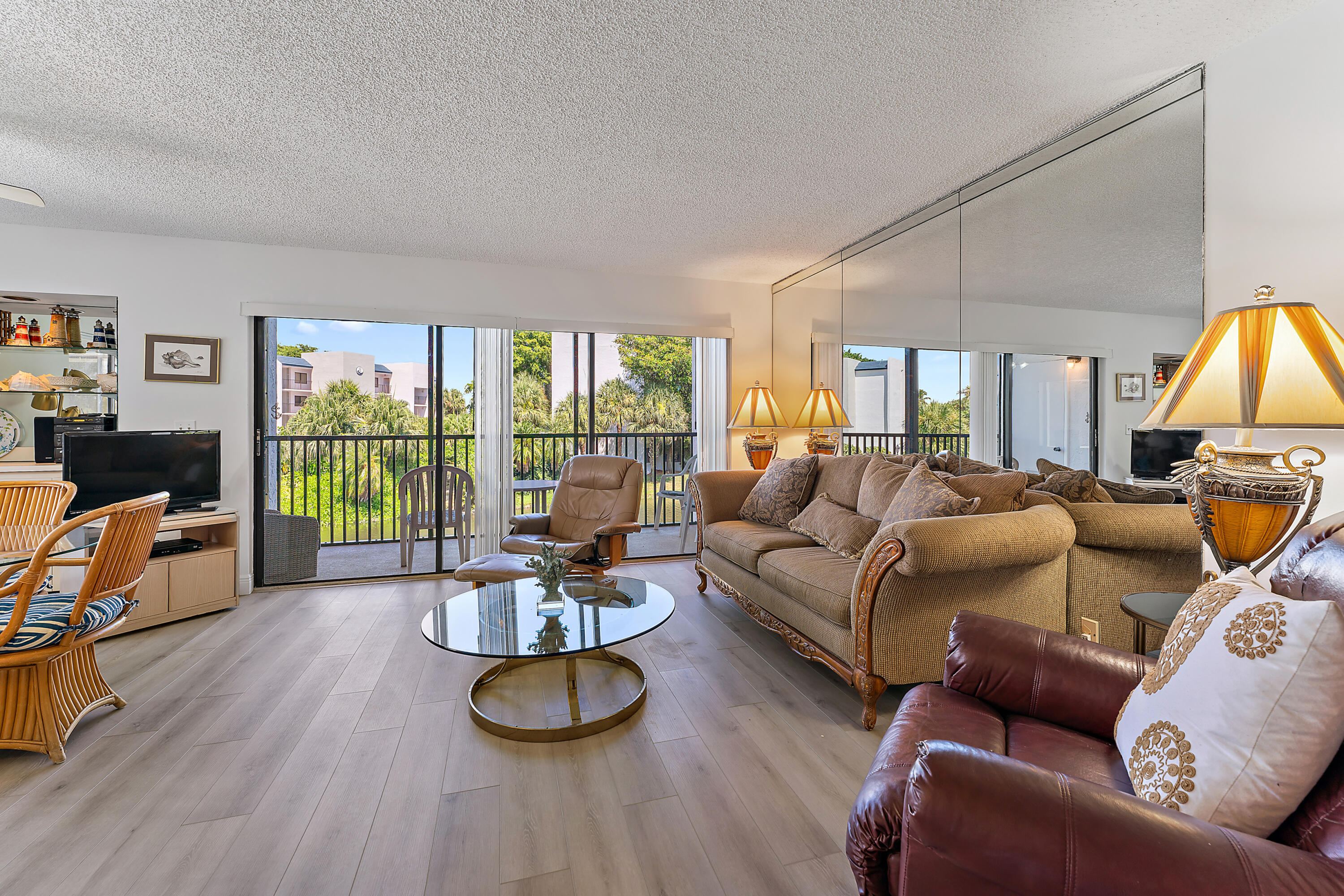 1605 Highway 1, Unit B201 Jupiter, FL 33477 - Photo 4 of 33 a living room with furniture and a flat screen tv