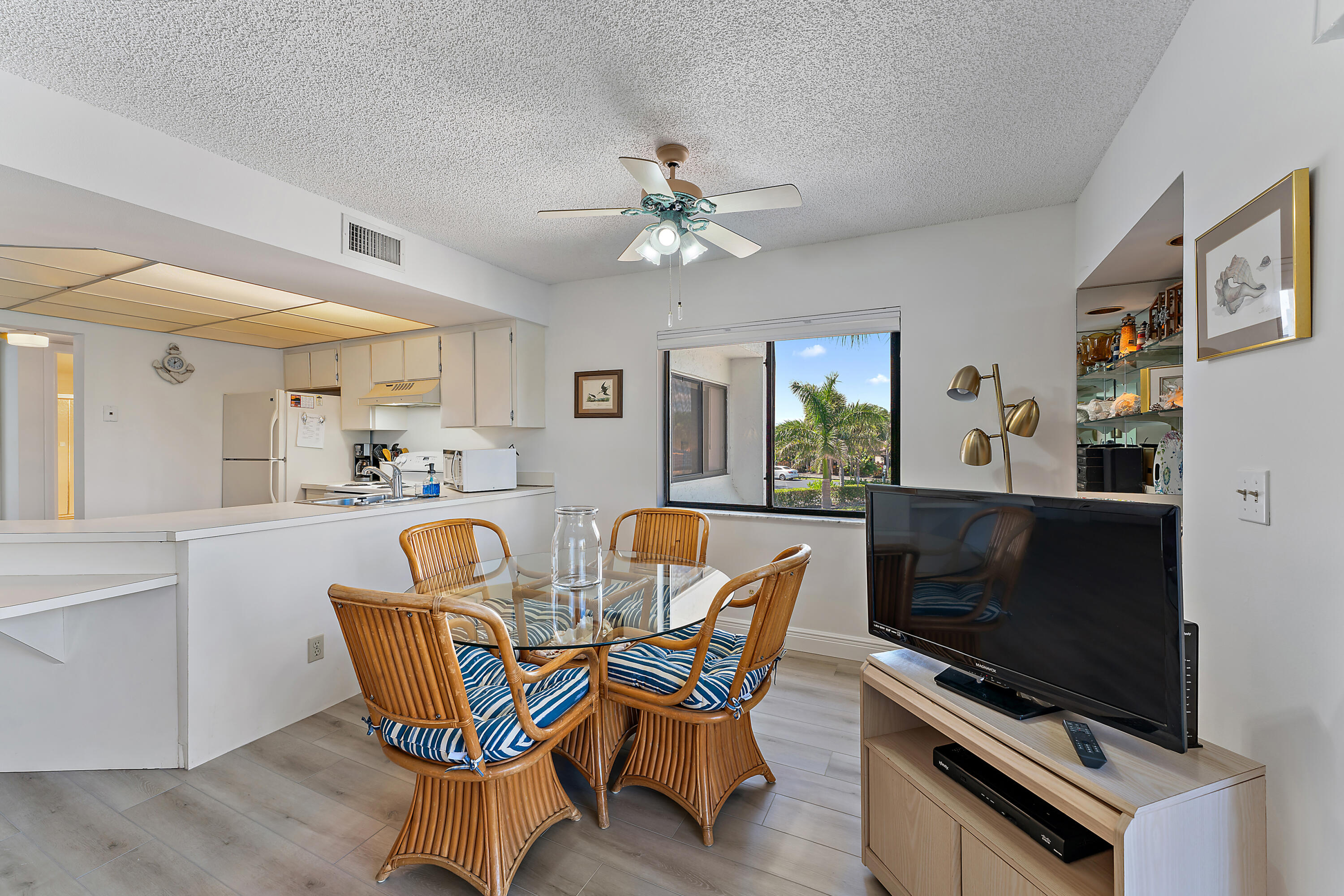 1605 Highway 1, Unit B201 Jupiter, FL 33477 - Photo 8 of 33 a dining room with furniture and window