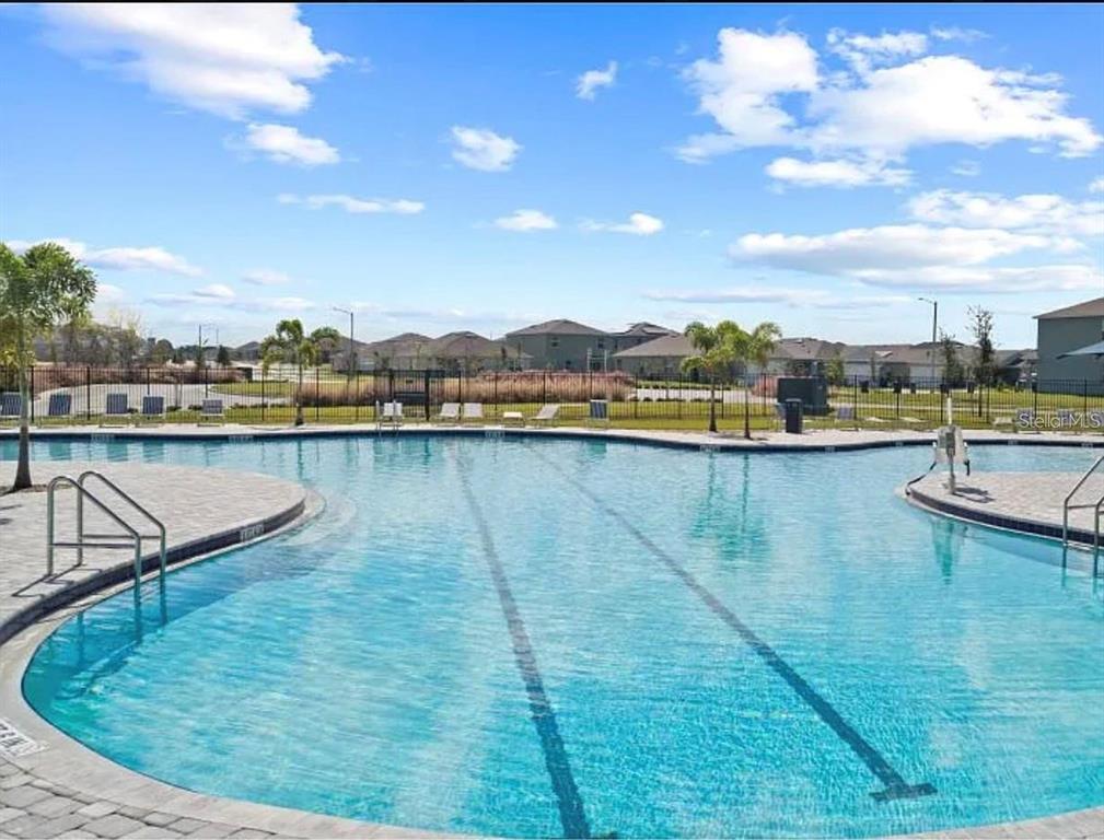 202 Brave Road Davenport, FL 33837 - Photo 15 of 17 a view of a lake with a mountain