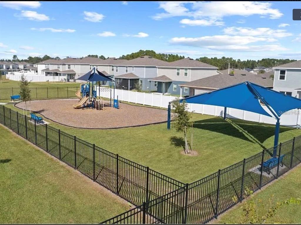 202 Brave Road Davenport, FL 33837 - Photo 16 of 17 a terrace with outdoor seating and city view