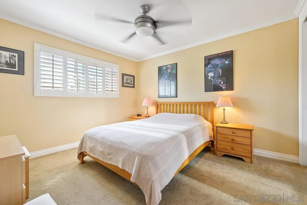 6780 Mission Gorge Road, Unit 12 San Diego, CA 92120 - Photo 11 of 23 a bedroom with a bed and a window