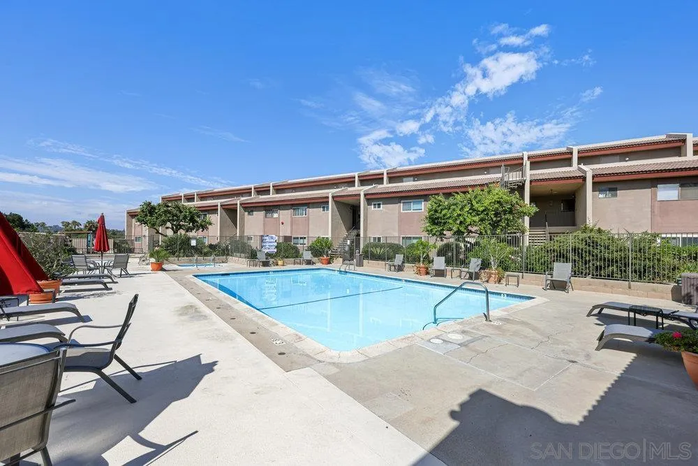 6780 Mission Gorge Road, Unit 12 San Diego, CA 92120 - Photo 20 of 23 a view of a house with swimming pool and sitting area