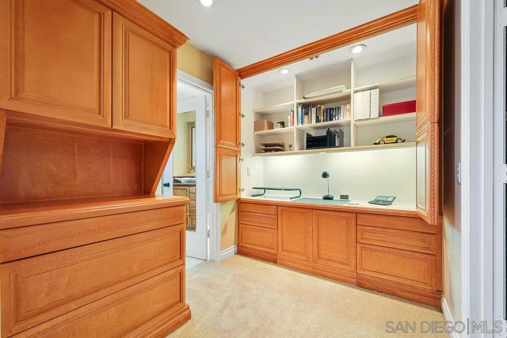 6780 Mission Gorge Road, Unit 12 San Diego, CA 92120 - Photo 8 of 23 a kitchen with stainless steel appliances granite countertop a refrigerator and cabinets