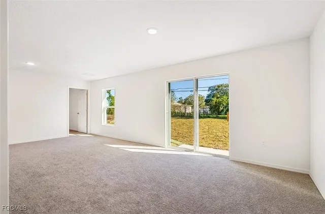 an empty room with windows