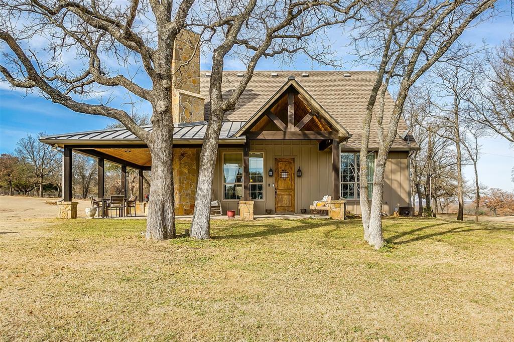 225 Falcon Drive Weatherford, TX 76088 - Photo 1 of 1 a front view of a building with a garden