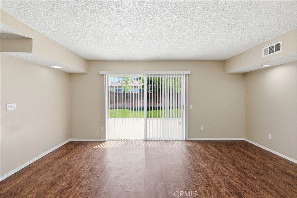 1420 Timberlane Drive Riverside, CA 92506 - Photo 11 of 61 a view of an empty room with wooden floor