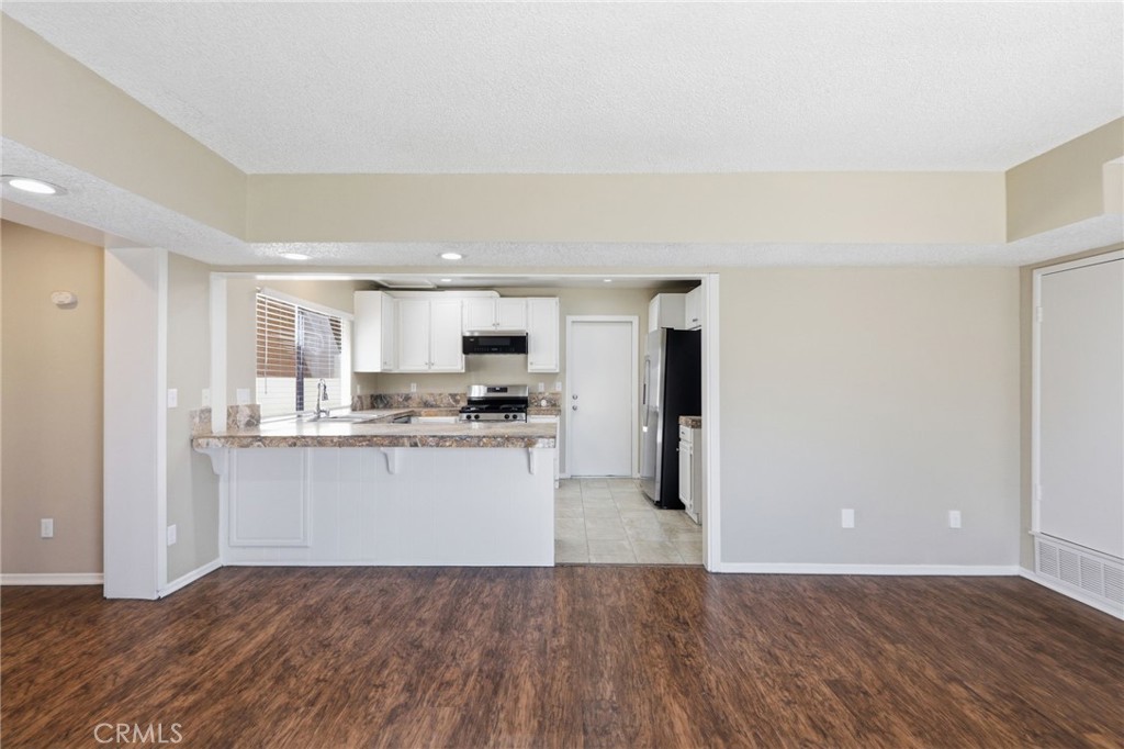 1420 Timberlane Drive Riverside, CA 92506 - Photo 14 of 61 a view of kitchen with wooden floor