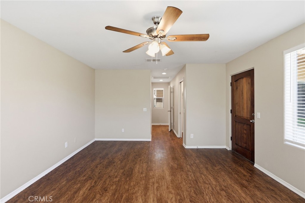 1420 Timberlane Drive Riverside, CA 92506 - Photo 22 of 61 a view of an empty room with wooden floor and a window