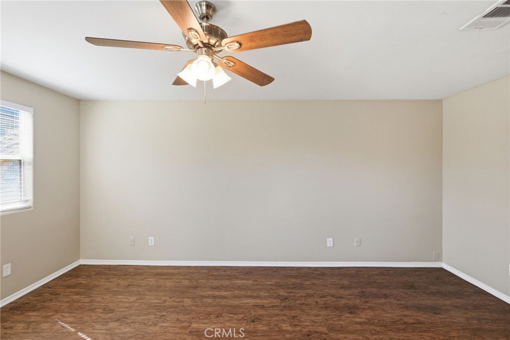 1420 Timberlane Drive Riverside, CA 92506 - Photo 23 of 61 a view of an empty room with window and wooden floor