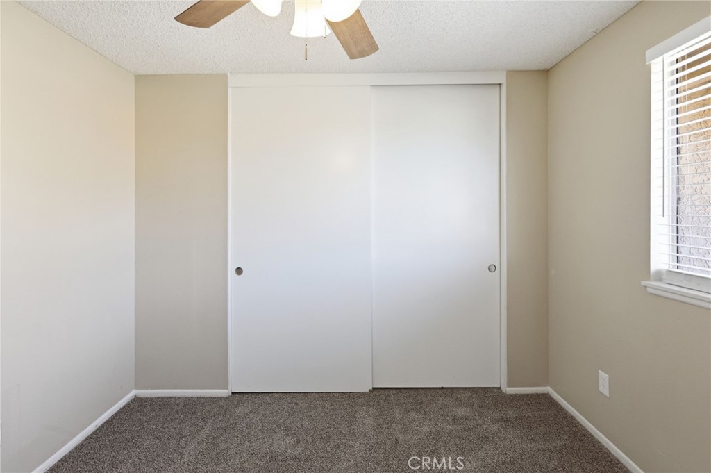 1420 Timberlane Drive Riverside, CA 92506 - Photo 32 of 61 an empty room with windows