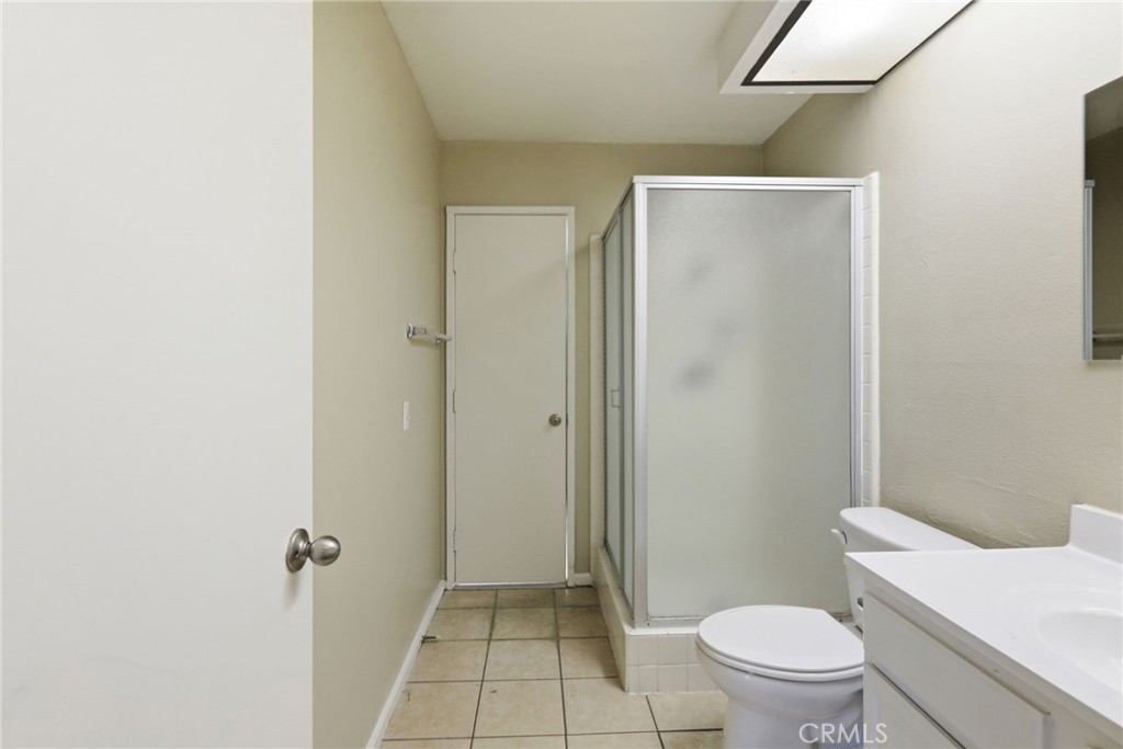 1420 Timberlane Drive Riverside, CA 92506 - Photo 41 of 61 a white toilet sitting next to a bathroom sink