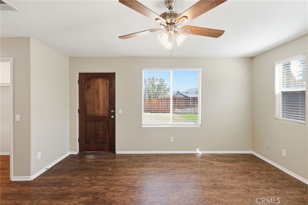 1420 Timberlane Drive Riverside, CA 92506 - Photo 5 of 61 an empty room with window and a ceiling fan