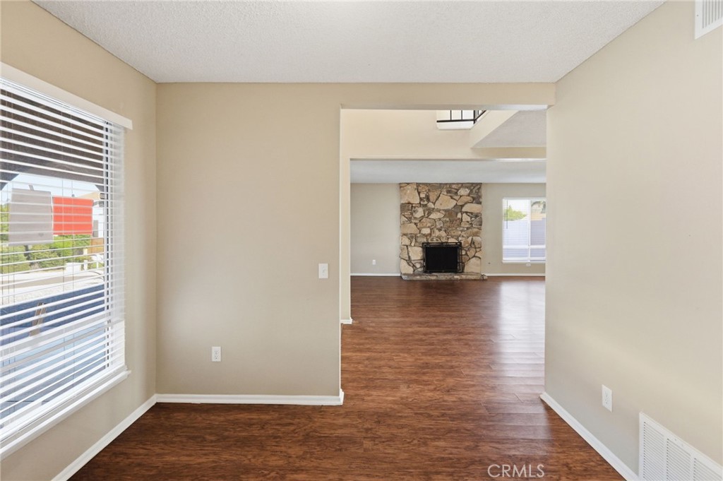 1420 Timberlane Drive Riverside, CA 92506 - Photo 10 of 61 a view of a livingroom with wooden floor and a large window
