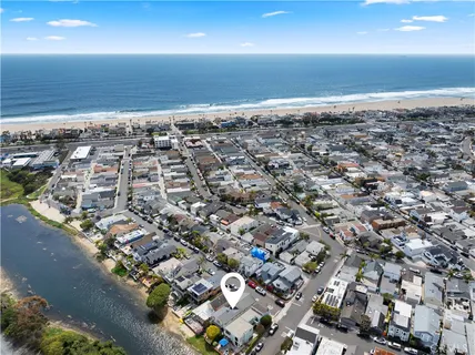 a kitchen with stainless steel appliances granite countertop a refrigerator a stove and a sink with cabinets