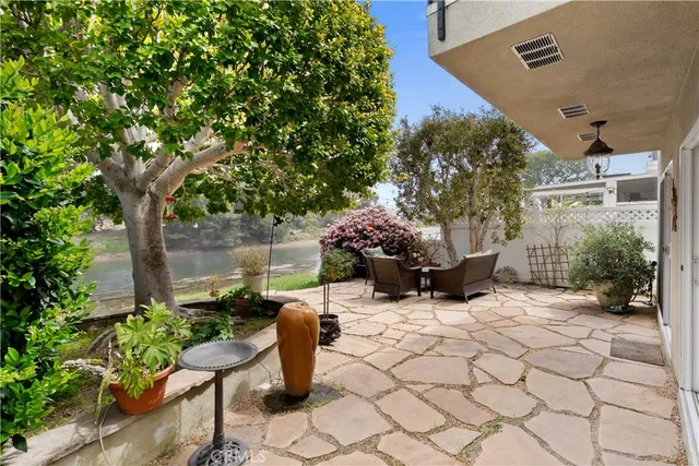 a view of a chair and table in backyard