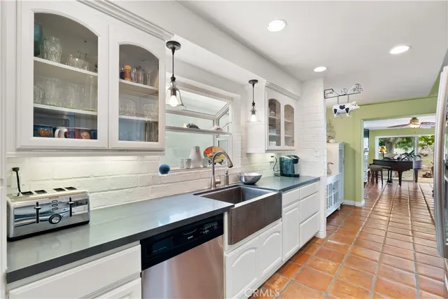 a kitchen that has a sink and a stove