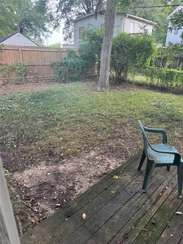 a view of a backyard with a sitting area