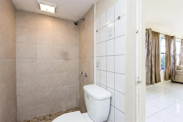 a kitchen with a table chairs and a refrigerator