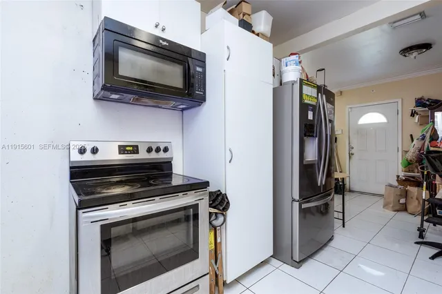 a kitchen with a stove and a microwave