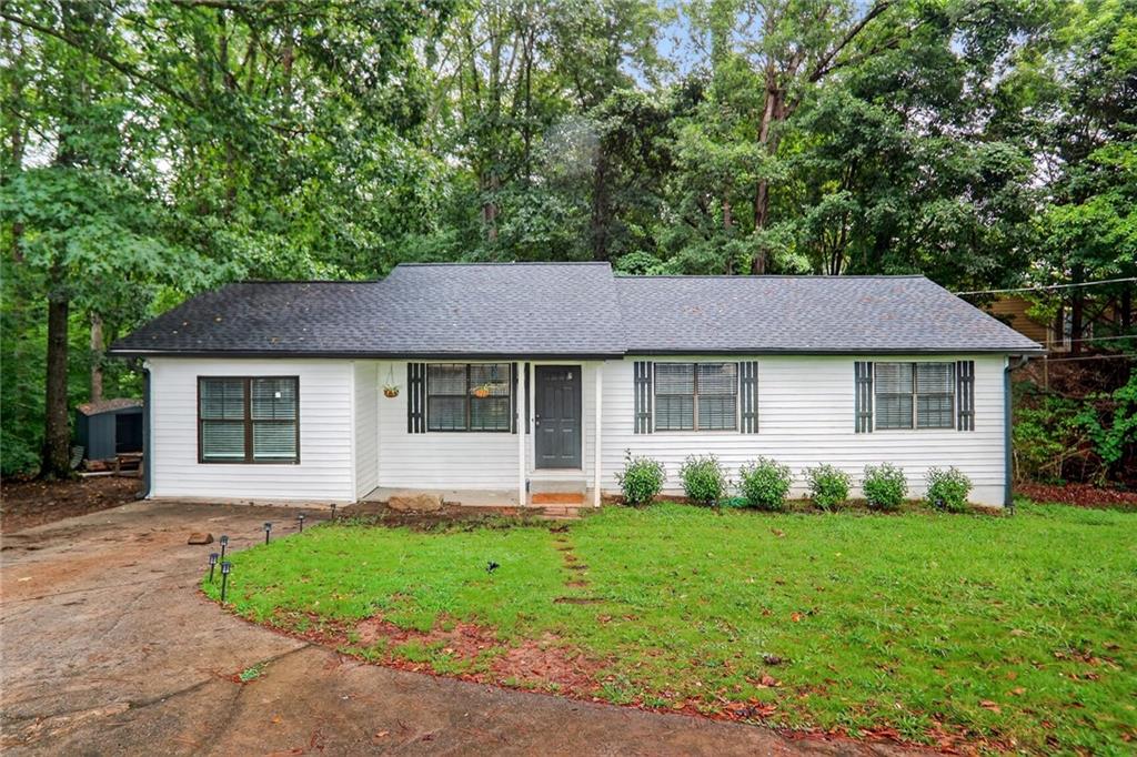 a aerial view of a house with a yard and plants