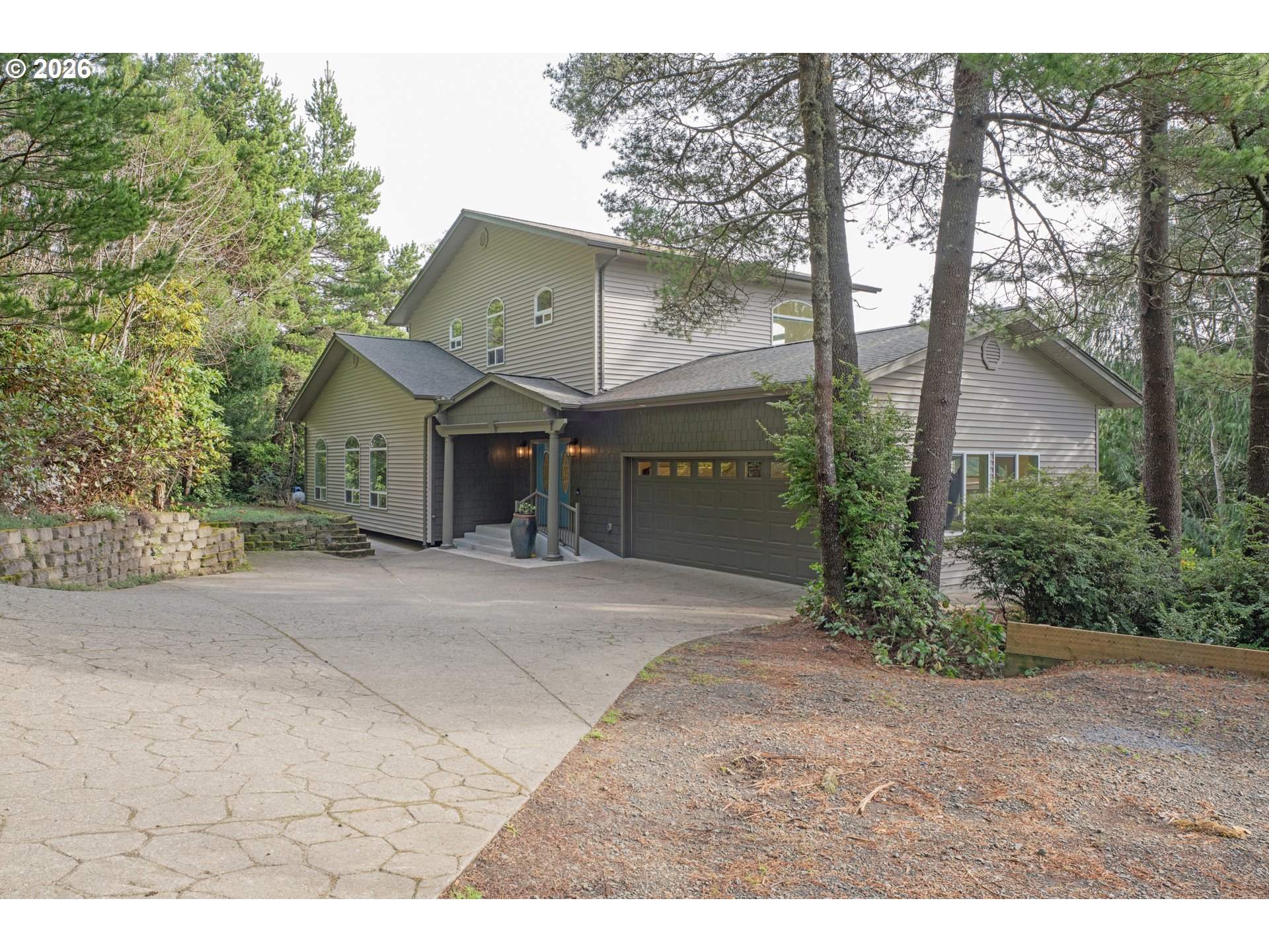 5816 Martin Road Florence, OR 97439 - Photo 5 of 47 a front view of a house with garden