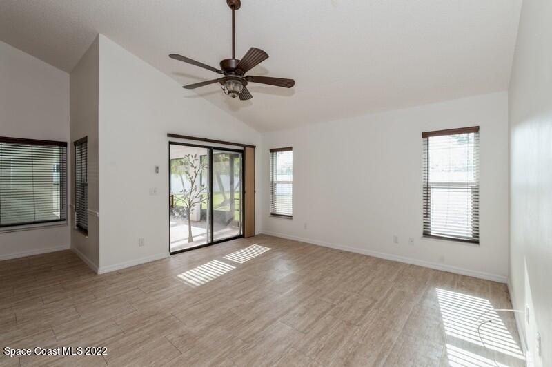 711 Montclair Road Northeast Palm Bay, FL 32905 - Photo 13 of 35 a view of an empty room with a window