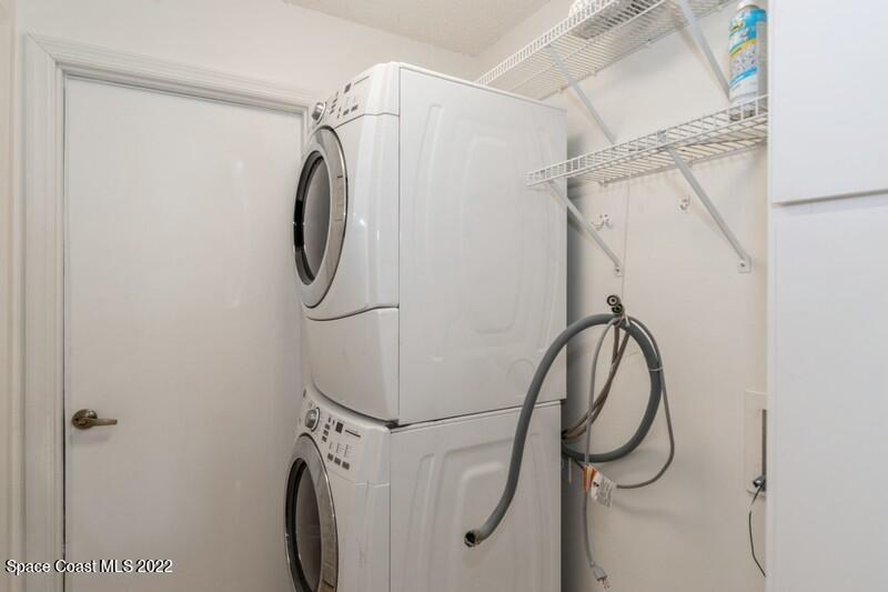 711 Montclair Road Northeast Palm Bay, FL 32905 - Photo 28 of 35 a bathroom with a shower and a mirror