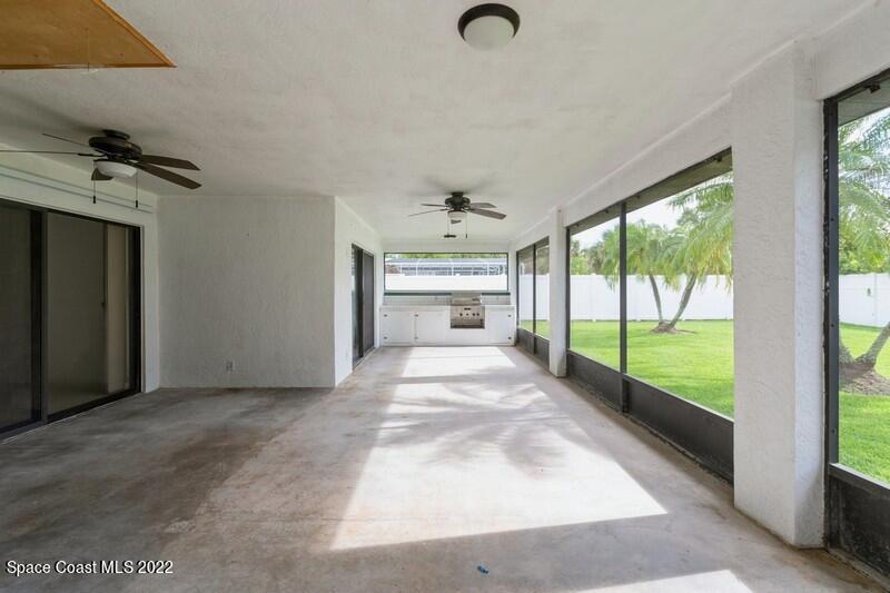 711 Montclair Road Northeast Palm Bay, FL 32905 - Photo 29 of 35 en empty room with windows