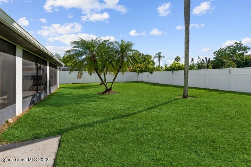 711 Montclair Road Northeast Palm Bay, FL 32905 - Photo 32 of 35 a view of a garden
